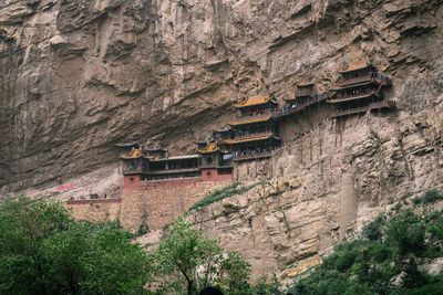 Low angle view of building and mountains