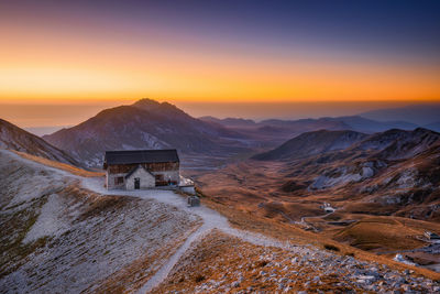 Scenic view of mountains against sky during sunset