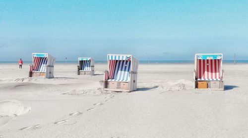 Hooded beach chairs on beach
