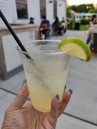 Midsection of person holding drink