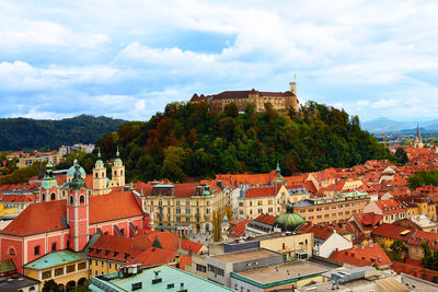 View of town against cloudy sky