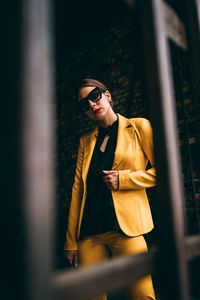 Portrait of businesswoman seen through window