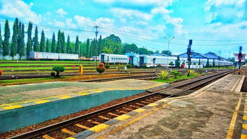 Train on railway tracks against sky