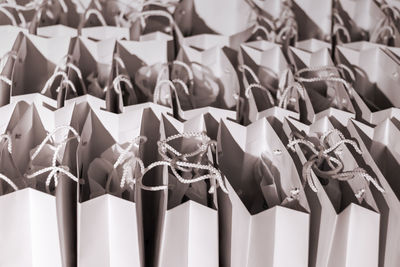Close-up of clothes hanging in row for sale