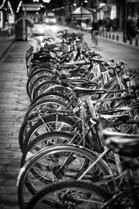 Close-up of bicycles parked on street