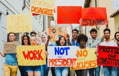 People protesting while standing on land