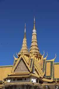 Low angle view of building against blue sky