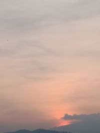 Low angle view of cloudy sky during sunset