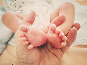 Low section of baby feet