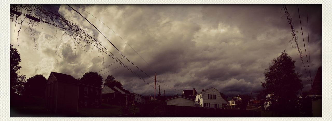 transfer print, building exterior, sky, built structure, architecture, cloud - sky, auto post production filter, cloudy, house, residential structure, weather, silhouette, residential building, low angle view, storm cloud, dusk, city, cloud, overcast, building