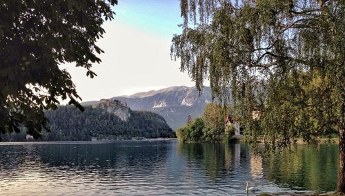 Scenic view of lake and mountains against sky