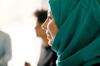 Close-up of businesswoman wearing hijab during meeting