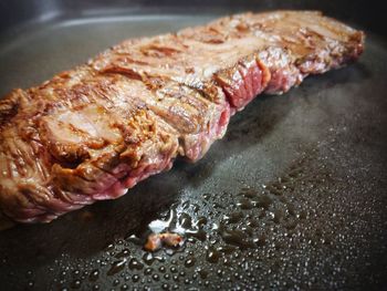 High angle view of meat on barbecue grill