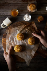 High angle view of woman preparing food on table