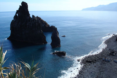 Scenic view of sea against blue sky