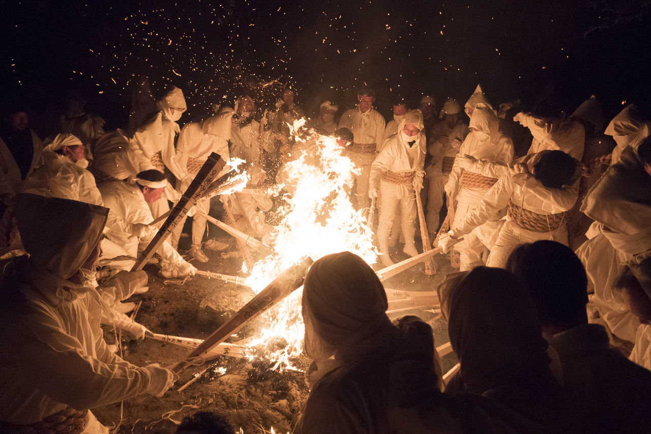 group of people, real people, crowd, large group of people, night, flame, fire, heat - temperature, fire - natural phenomenon, burning, men, togetherness, women, event, celebration, performance, glowing, adult, bonfire, watching