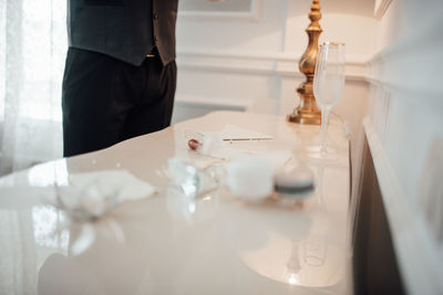 Midsection of man working on table