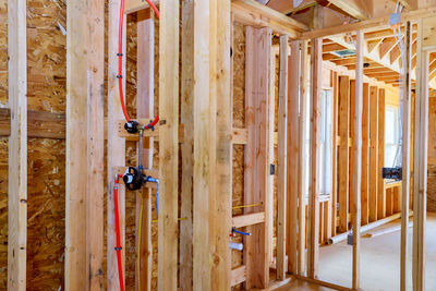 Close-up of wooden door of building at construction site