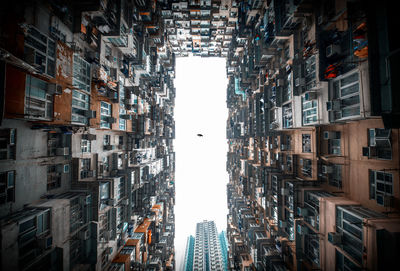 Low angle view of buildings in city against sky