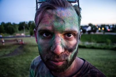Close-up portrait of man covered with powder paint