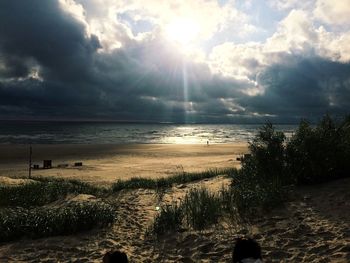 Scenic view of sea against cloudy sky