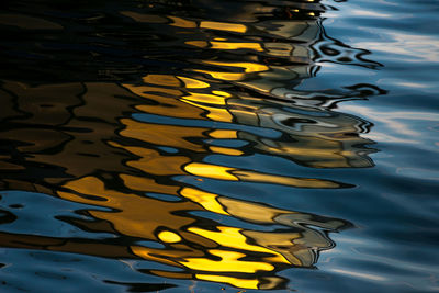 High angle view of yellow leaf floating on water