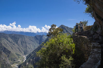 Couple on the inca trail path close to machu picchu