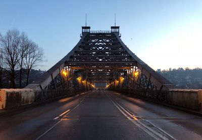 View of illuminated bridge against clear sky during winter