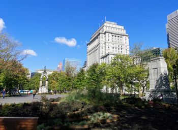 Low angle view of buildings against blue sky