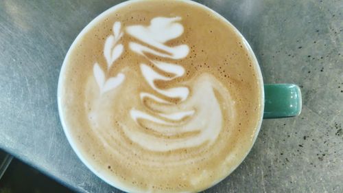 Close-up of cappuccino on table