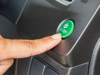 Close-up of human hand on shelf