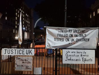 Information sign on illuminated building at night