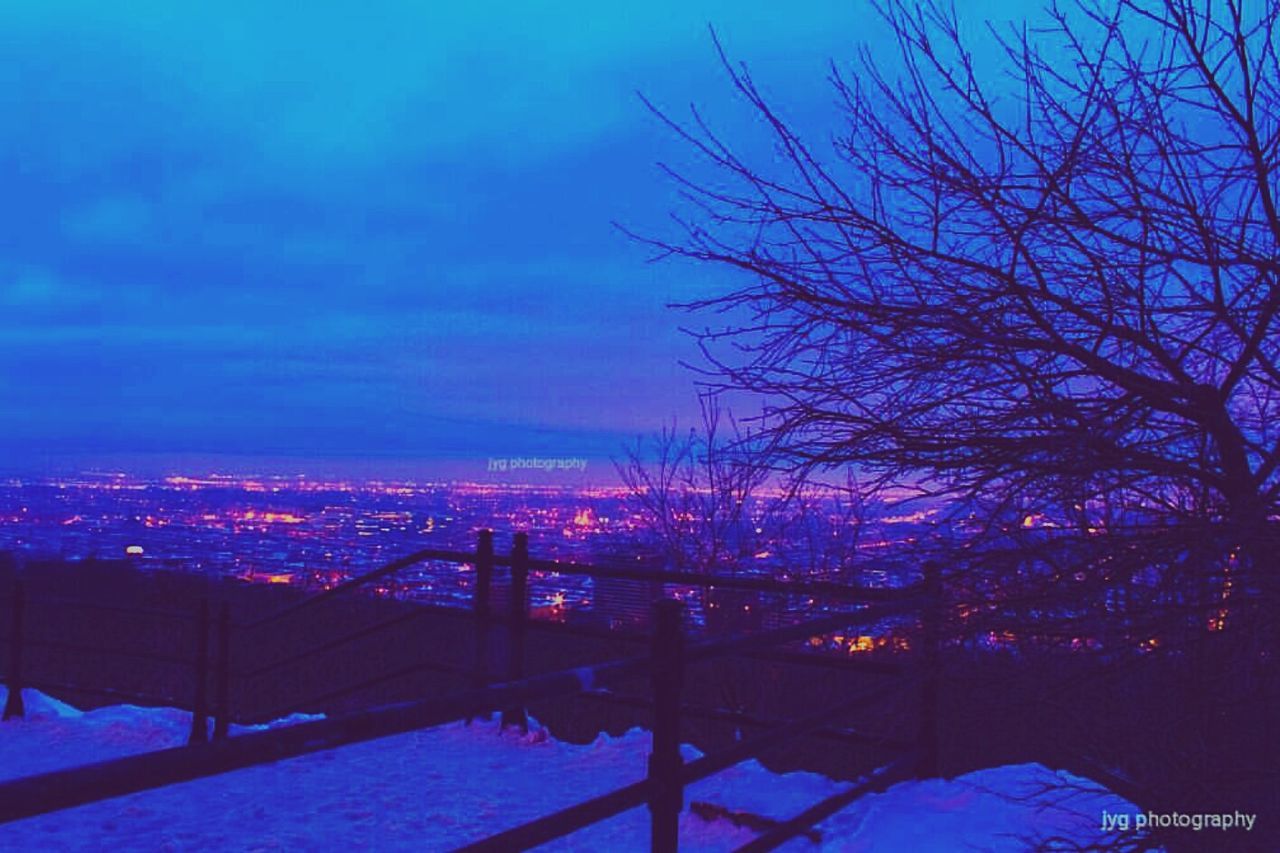 city, sky, bridge - man made structure, winter, sunset, cityscape, snow, built structure, outdoors, architecture, no people, tree, cold temperature, night, nature