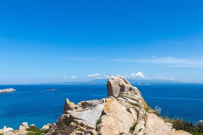 Scenic view of sea against blue sky