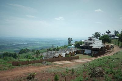 High angle view of houses and buildings against sky