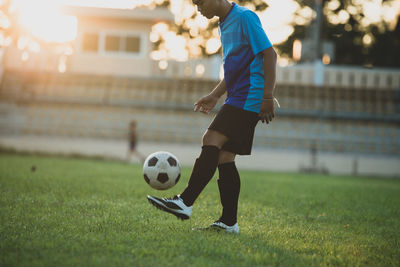 Man playing soccer on field