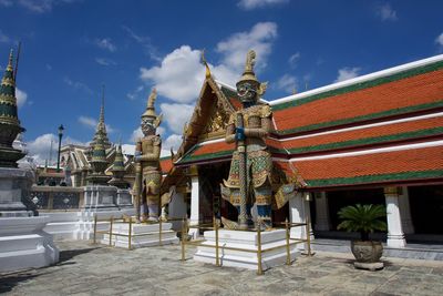 View of temple building against cloudy sky