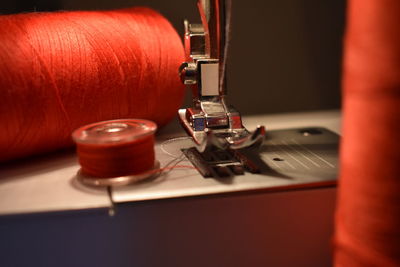 Close-up of sewing machine and thread