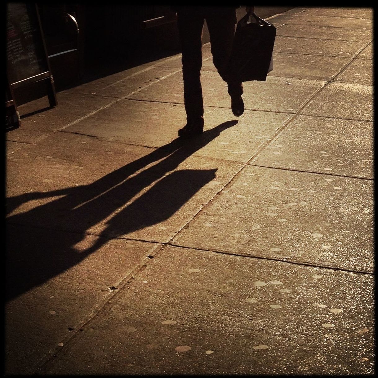 transfer print, walking, shadow, low section, lifestyles, street, men, auto post production filter, sunlight, leisure activity, person, night, sidewalk, standing, road, city life