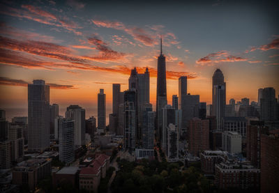 Cityscape against sky during sunset