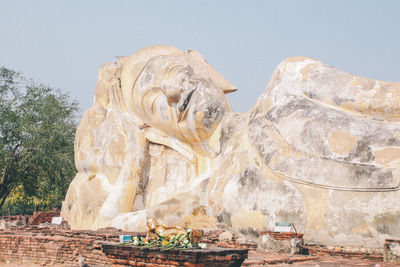 Low angle view of statue against sky