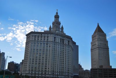 Low angle view of skyscrapers against sky