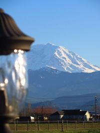 Scenic view of snowcapped mountains against clear sky