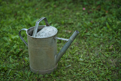 Close-up of drink on field