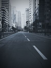 Road in city against clear sky