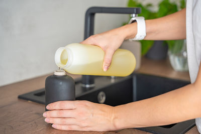 Cropped hands of man washing hand