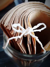 High angle view of paper in jar on table