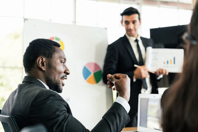 Businesspersons having discussion in office