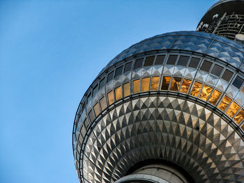 Low angle view of building against clear blue sky