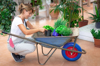 Woman holding potted plant